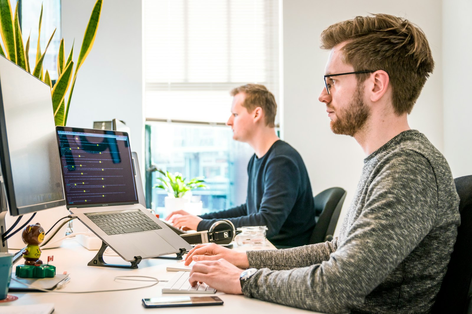 Engineers collaborating over code